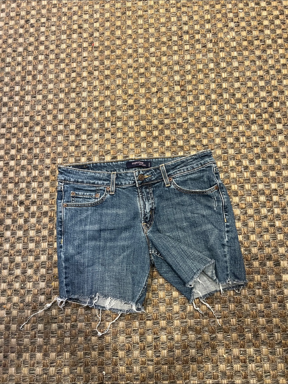 Levi's light blue denim shorts with frayed hem